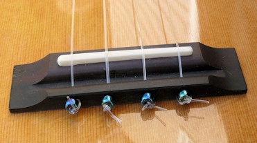 Beads on uke strings